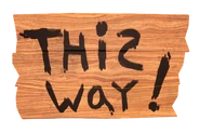 "This way!" Sign.