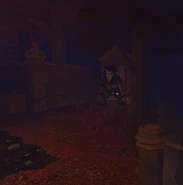 The Grimkeeper standing in front of an outhouse.