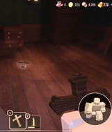 A player holding Crucifix while another is dropped on the ground, with the use of Candy.