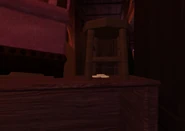 Coinsunderstool.jpg (88 KB) A pile of gold under a stool, unable to be picked up without the use of glitches or exploits.