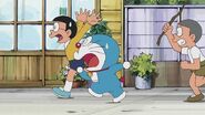 Nobisuke Nobi chases Doraemon and Nobita