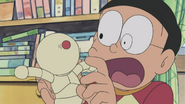 Nobita holding the robot