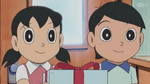 Dekisugi and Shizuka giving a present to Nobita.