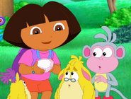 "¡Mira! I have a crystal!" Dora said as she shows the crystal she got from the Snow Princess.