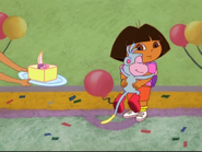 Dora giving Boots a birthday hug after he blew the candle. (YAY!!!!!)