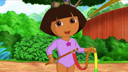 Dora demonstrates what to do at the end of the ribbon dance