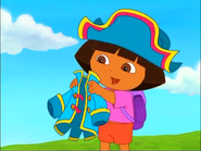 ...Dora gets a coat to match her hat!