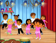 She explains to the viewer that it's a very special day for her dance class; they’re going to have a gigantic dance show for all their friends and families.