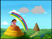 "¡Que bello!" said Dora. "What a beautiful rainbow!"