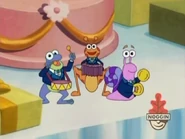 The Fiesta Trio play a special fanfare on the table while Dora and Boots changed into fancy clothes offscreen.