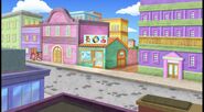 with Boots on a lovely town and they enter a toy store