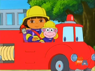 There he is! Wearing a firefighter helmet!