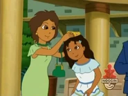 Daisy's mother puts the crown on.