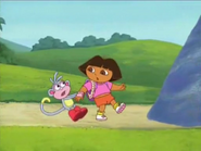 Boots grabs Dora's arm before she hits herself.