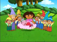 "YAY!" cheered the dwarves after Dora accepts their idea.