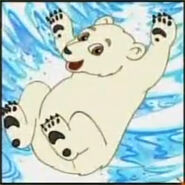 A polar bear sliding on its back to get down a snow hill