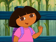 Dora tells the viewer they have to stand up to join in with the monkey dance. Now stand up, please! Stand up!