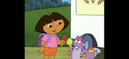 "¡Delicioso!" said Dora and Tico. (Dora has chocolate!)