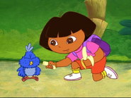 She feeds a banana to Baby Blue Bird.