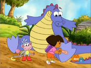 Dora gives the dragon the bandage.