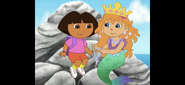 Mariana is about to give Dora a special mermaid necklace.