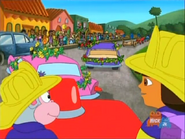 "There's a parade, and floats, and people in costumes!" (And they must be having a good time!)