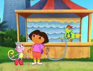 Dora and Boots getting ready to play the squirting dolphins game