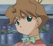 Yuki in front of her family's business.