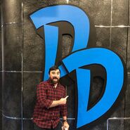 Production Coordinator, Matthew Curley poses with the "DD" sign