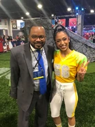 Liza poses with a CBS reporter
