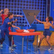 Kira and Lindsey attempt throw an egg at Liza