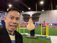Nickelodeon Executive in Charge of Production, Mandel Ilagan poses in front of Pick It