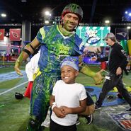 Russell Wilson poses with a fan