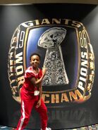 Dallas poses with the Super Bowl ring