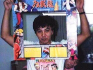 Yoshihisa Kishimoto - 03.jpg (25 KB) Kishimoto holding what appears to be an early version of the Double Dragon II arcade bezel.