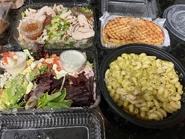 Family Meal: Chopped Salad, Turkey Avocado Cobb Salad, Chicken Pomodori Panini, Pesto Cavatappi