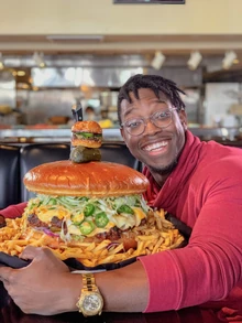 Ify told a story about trying to eat an insane 14-lb. burger. This is the pic, via @ifynwadiwe.