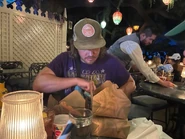 Wiger shoveling food