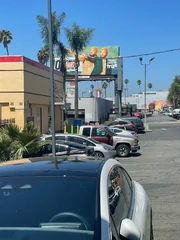 Gabrus and Pally's billboard over the Burger King
