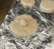 "The biscuit with a hat (AKA 'the boob biscuit') right before it was put into the oven"