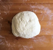"And here are some looks at the baking process. This was the dough right after it's first kneading. I hand kneaded for about 10 mins."