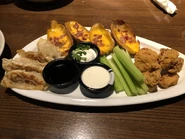 App Sampler: Pan-Seared Pot Stickers, Loaded Potato Skins, Garlic Parmesan Boneless Chicken Wings