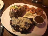 Ribeye with Baked Potato and Gold Coast Coconut Shrimp