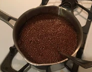 Gingerbread Cookies Process #1: "We got a few pics from the baking process for the Holiday Special’s gingerbread cookies. First, here’s how it looked after adding baking soda to the heated up sugar, molasses, & shortening mixture. Look at that exciting bubbly reaction"