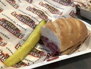 Smokehouse Beef & Cheddar Brisket Hot Sub and a Pickle