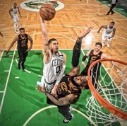 Jayson Tatum dunking on LeBron James