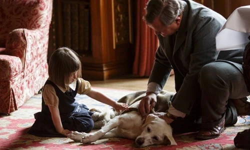 Lord Grantham and Sibby with a sick Isis