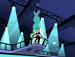 Ember McLain emitting a green aura.