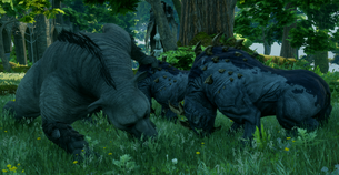 A great bear fighting two brontos