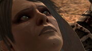 Close-up of Leandra dying in Hawke's arms